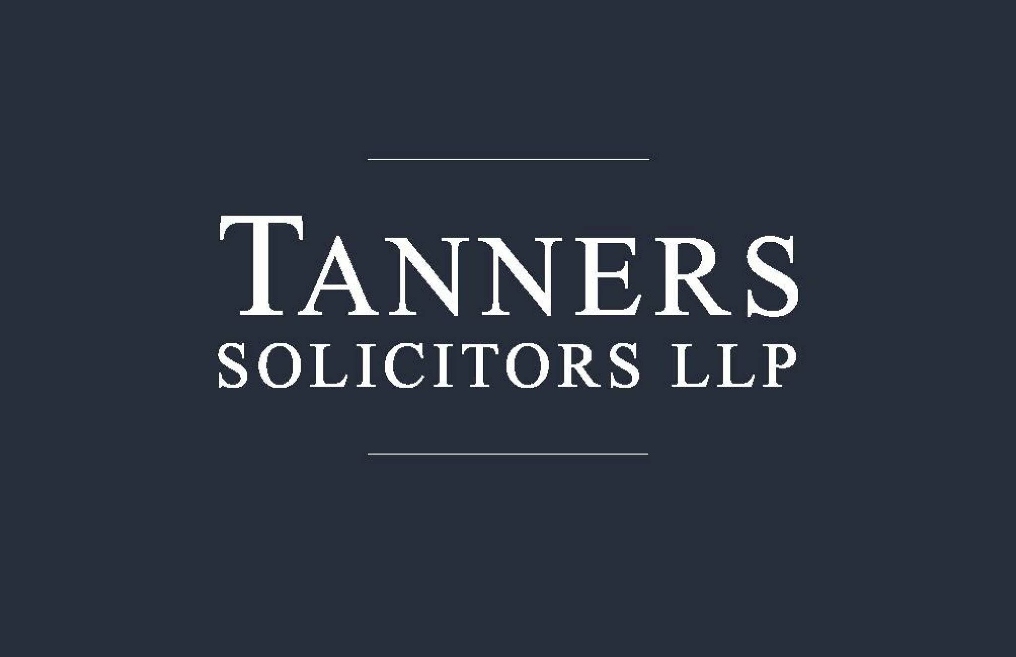 Tanners Logo white on blue background1.jpg